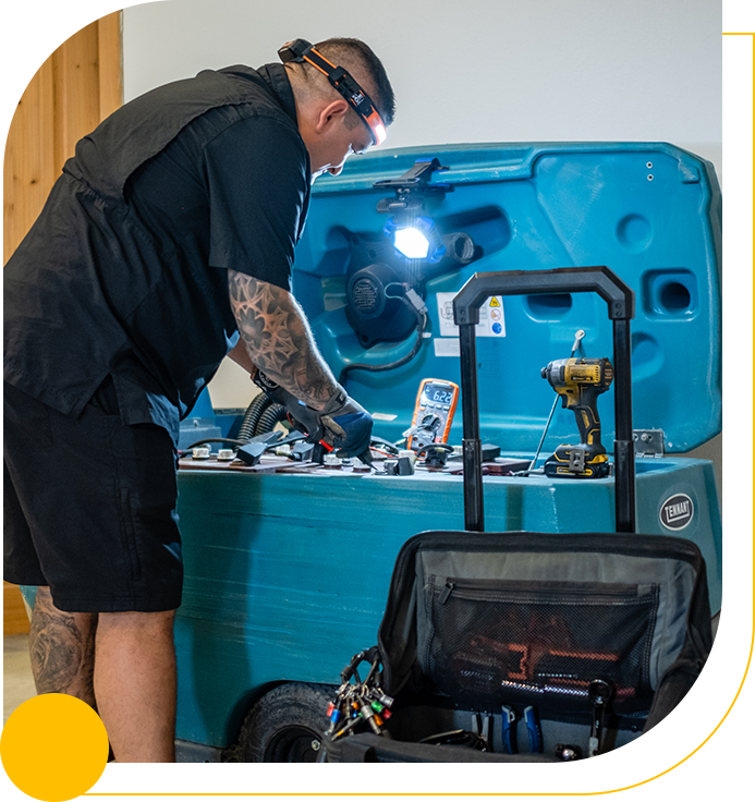 A man standing next to an ice chest.