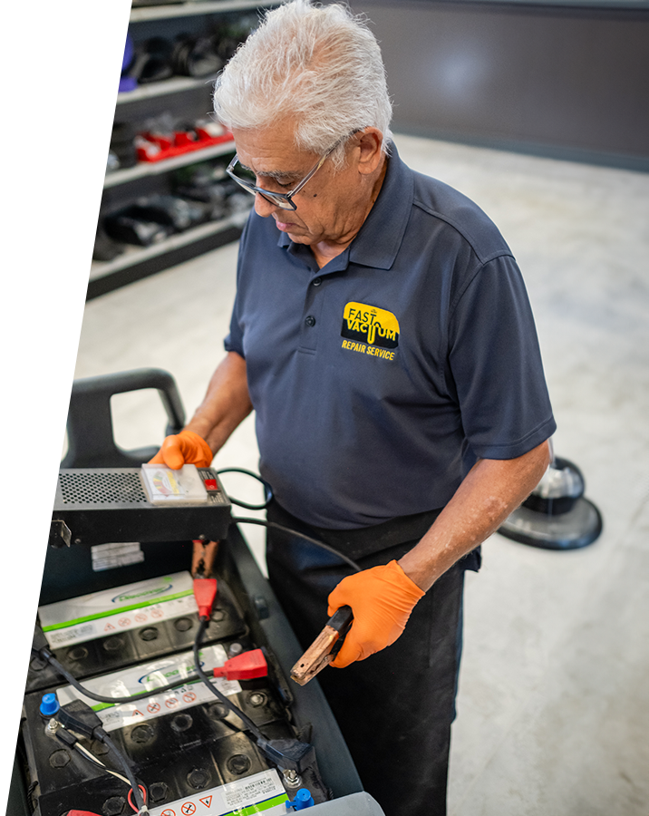 A man working on an electrical device in the shop.