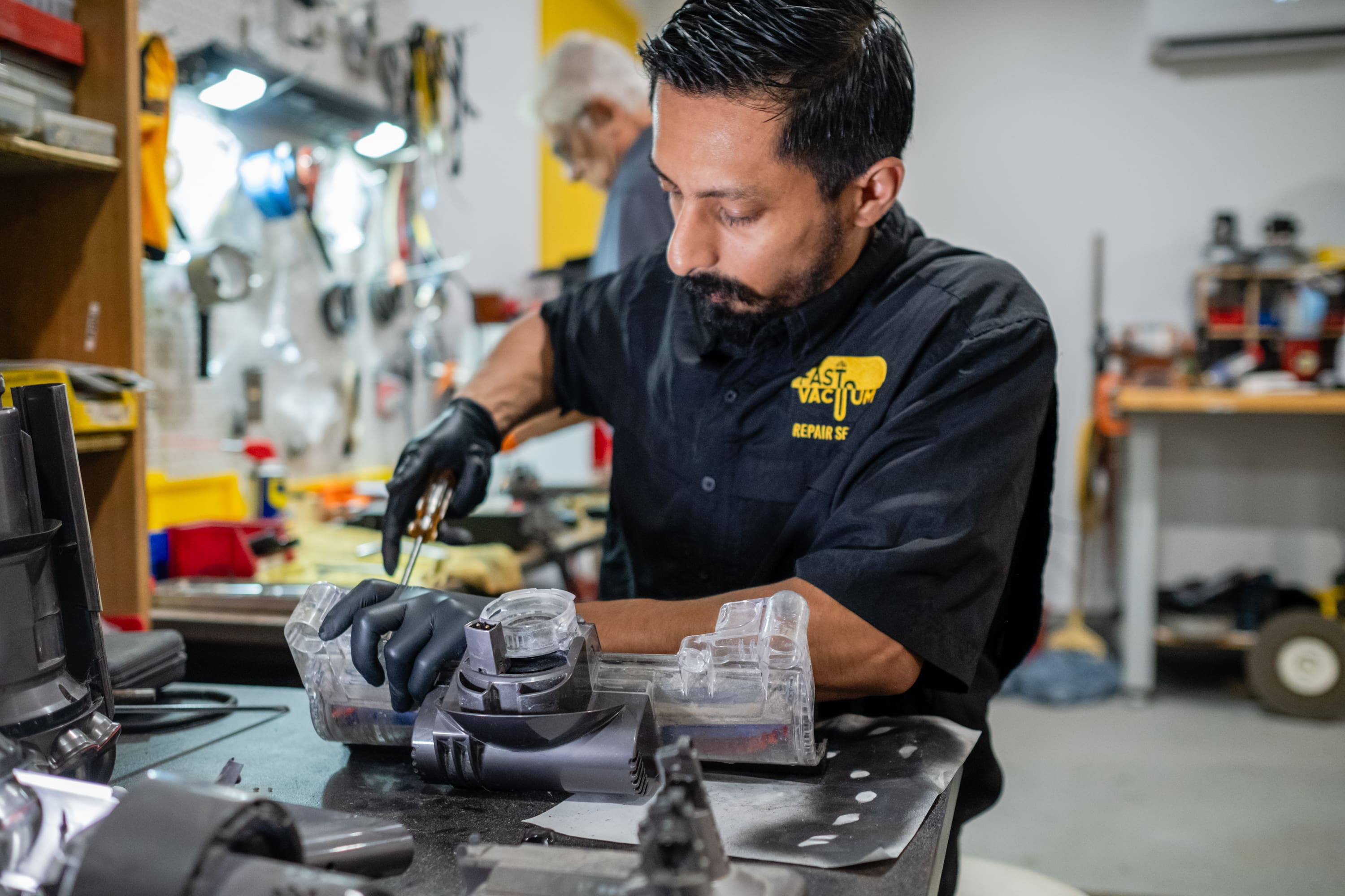 A man working on something in a shop.